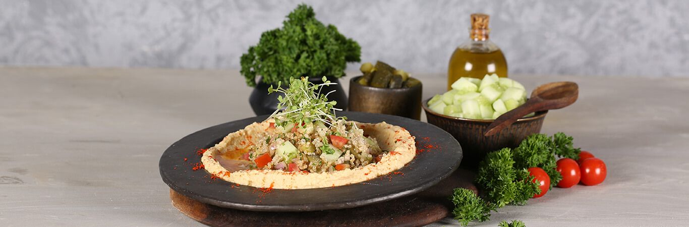 Eat healthy with Arabian Warm Quinoa On A Bed Of Hummus